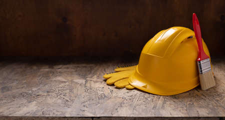 Construction tools at wooden table background texture. Tool kit on tabletop concept of repair