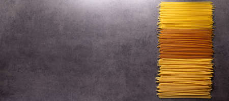 Pasta spaghetti on table background. Raw pasta spaghetti  at stone tabletopの写真素材