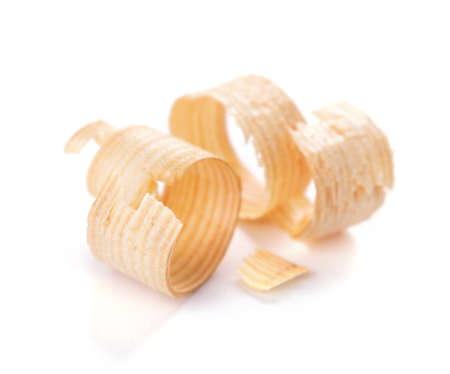 Wood shavings isolated on white background. Wooden shaving at whiteの写真素材