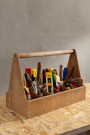 Construction tools and toolbox on wooden table background texture. Tools kit and tool box