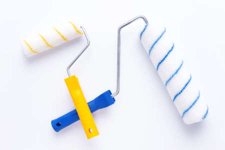 Paint roller at white background. Construction tool for house room renovationの写真素材