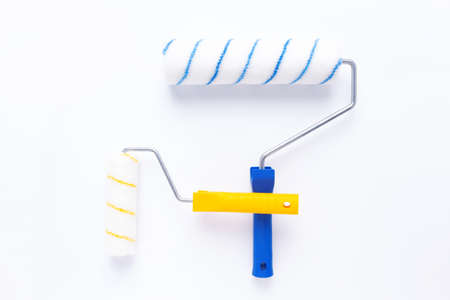 Paint roller at white background. Construction tool for house room renovationの写真素材