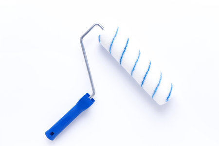 Paint roller at white background. Construction tool for house room renovationの写真素材