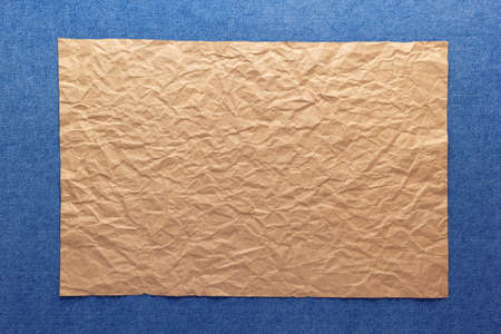 Blue jeans denim background texture and brown craft paper. Jeans fabric materialの写真素材