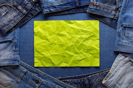 Blue jeans denim background texture and wrinkled paper. Jeans fabric material