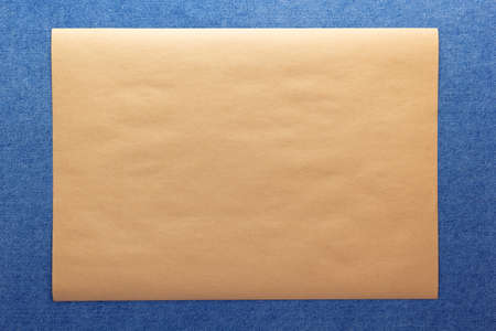 Blue jeans denim background texture and brown craft paper. Jeans fabric materialの写真素材