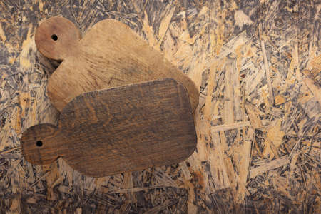 Wood cutting board at wooden osb  background top table