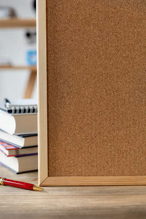 Back to school concept. Cork board frame background at table in office. Student home workplaceの写真素材