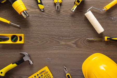 Wood laminate and tools at floor background texture. Wooden laminate top view