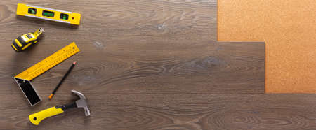 Wood laminate and tools at floor background texture. Wooden laminate top viewの写真素材