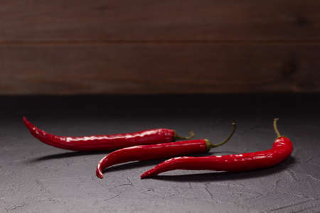 Chile pepper for homemade cooking on table. Recipe concept in kitchenの写真素材
