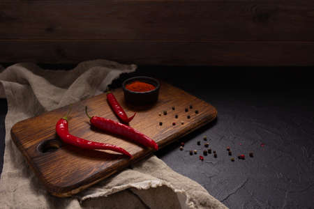 Chile pepper and tomato sauce ingredient for homemade cooking on table. Recipe concept in kitchen