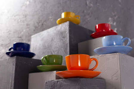 Cup of coffee on table. Coffee beans  and cups at cement block background textureの写真素材