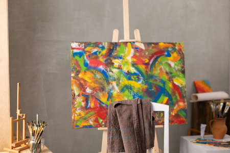 Chair and oil painting. Art still life and paintbrush painting in artist creative studio with painter toolの写真素材