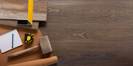 Wood laminate and tools at floor background texture. Wooden laminate top viewの写真素材