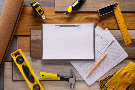 Wood laminate and tools at floor background texture. Wooden laminate top viewの写真素材