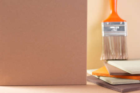 Paintbrush tool on abstract background. Construction paint brush for house room renovationの写真素材