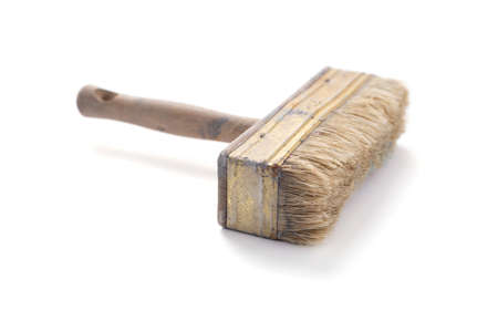 Old used paintbrush tool isolated on white background. Construction paint brush for house room...