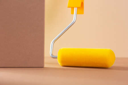 Paint roller tool on abstract background. Construction paint tool for house room renovation