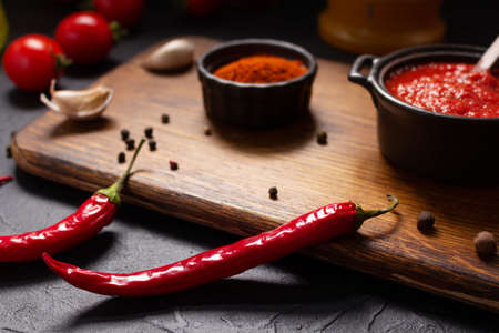 Chilly pepper and spices ingredient for homemade cooking on table. Chilli and recipe concept in kitchenの写真素材