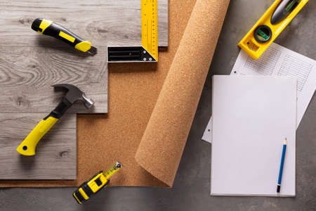 Wood laminate and tools at floor background texture. Wooden laminate top viewの写真素材