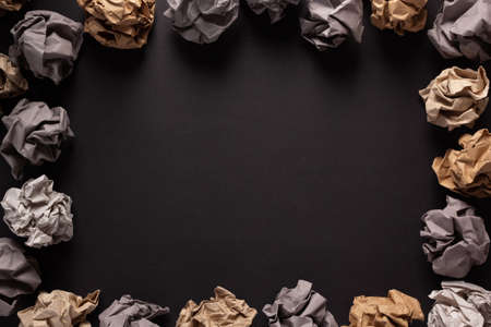 Crumpled paper balls at black background texture. Inspiration creative idea conceptの写真素材
