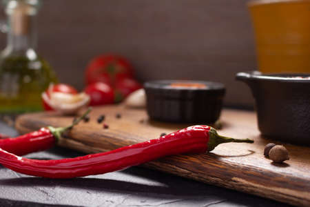 Chilly pepper for homemade cooking on table. Chilli pepper at tabletopの写真素材