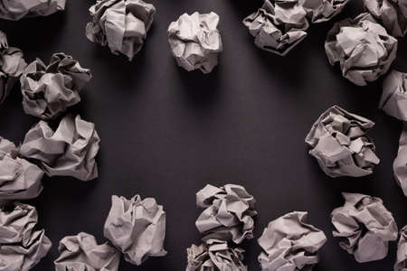 Crumpled paper balls at black background texture. Inspiration creative idea conceptの写真素材
