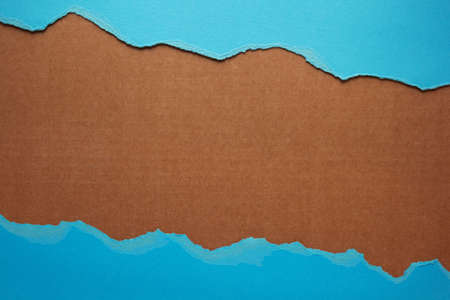 Torn edge of paper as background texture. Ripped paper at parcelの写真素材