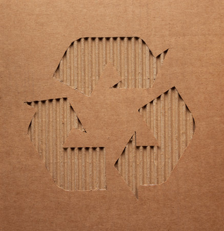 Recycle symbol at  recycled paper background texture. Recycling idea concept and cardboard paperの写真素材