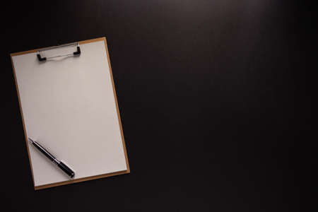 Clipboard and paper at black background texture. Creative idea conceptの写真素材