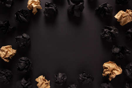 Crumpled paper balls at black background texture. Inspiration creative idea conceptの写真素材