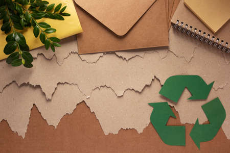 Recycling concept  and waste paper heap. Recycle symbol and product from recycled paperの写真素材