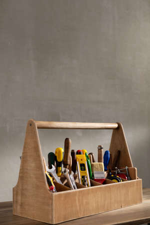 Construction tools and toolbox on wooden table background texture. Tools kit and tool boxの写真素材