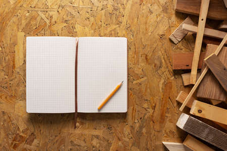 Notebook and wood at chipboard plywood background texture. Wooden plank barの写真素材