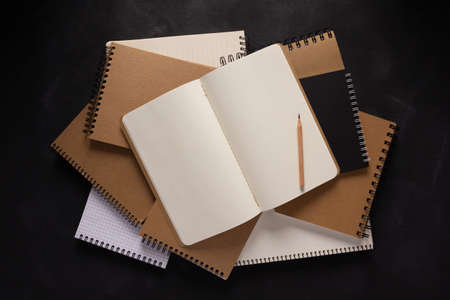 Paper notebook at black background texture. Creative idea conceptの写真素材