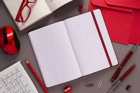 Paper notebook and stationary supplies at table background texture. Office business concept ideaの写真素材