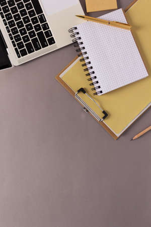 Paper notebook and stationary supplies at table background texture. Office business concept ideaの写真素材