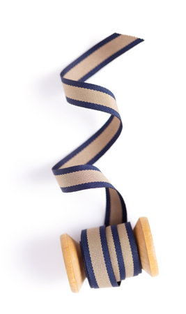 Spool with ribbon isolated at white background, top view. Sewing ribbon rollの写真素材