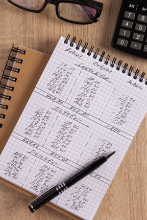 Business accounting workplace and stationary supplies at desk table background. Financial budget or saving concept ideaの写真素材