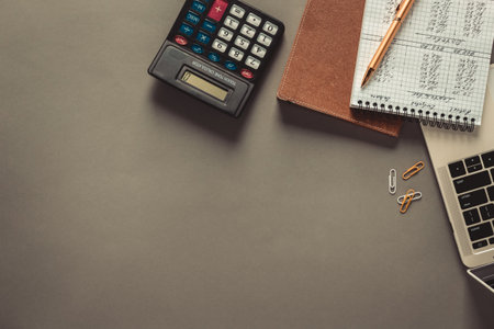Business accounting workplace and stationary supplies at table background. Financial budget or...
