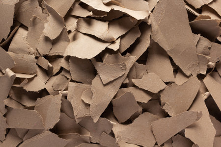 Pieces of torn paper as background texture. Recycling concept and heap of waste cardboardの写真素材
