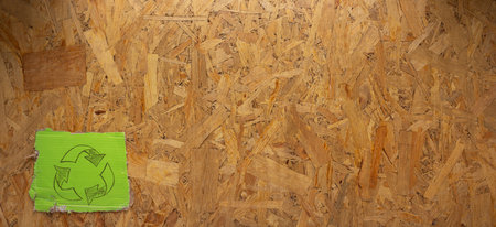 Recycle symbol at  chipboard OSB background texture. Recycling idea concept and cardboard paperの写真素材