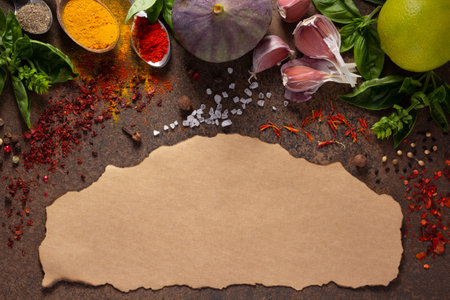 Variety of spices and herbs on table background. Cooking concept and ingredients at table top viewの写真素材