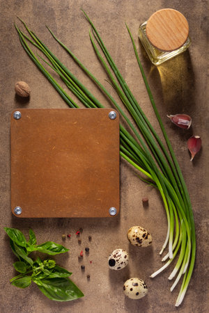 Green onion chives and egg on table background. Cooking concept and salad ingredients at tabletop top viewの写真素材