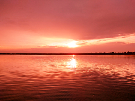View of the lake at sunset in the evening in summer dayの写真素材