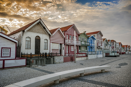 Costa Nova do Prado ( Portugal) famous home Palheiros with their houses with colorful stripes derived from original wooden houses of fishermen, famous as home Palheiros. Evening.のeditorial素材