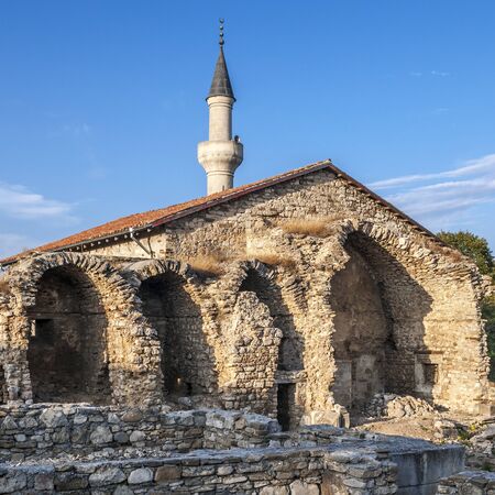 The peninsula of Crimea the city of Stary Krym. Khan Uzbek Mosque and the ruins of a building adjacent to it madrassa religious school.の写真素材