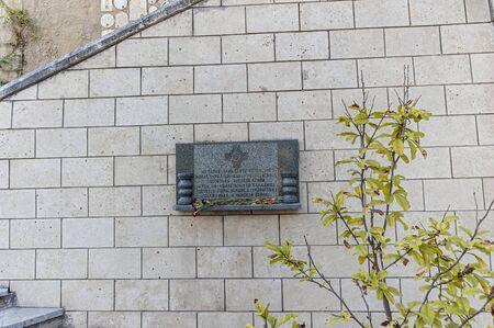 Bakhchisaray , Crimea , Russia . Holy - Assumption Orthodox cave Monastery .Memorial plaque that during the Crimean War here was located a hospital of the Russian army .の写真素材