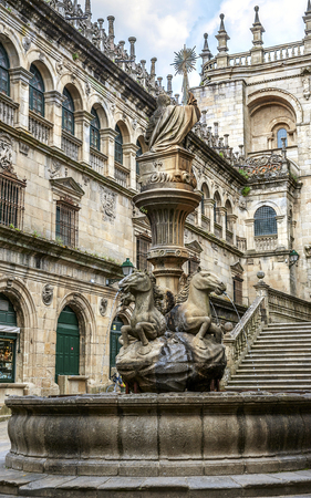 Spain, Sentyago de Compostela. Cathedral of St. Jacob, fountain Los Caballos.On the image is not a castle, not a palace, not a manor - it is a acting religious building to visit the believers.のeditorial素材